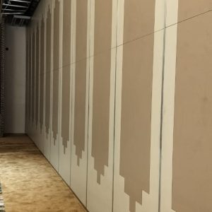 Wooden sliding partition installation at Deepti Courtyard luxury hotel banquet hall in Rourkela